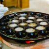 Making Thai coconut pancakes (khanom krok)