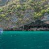 Speedboat under limestone cliffs, Phi Phi