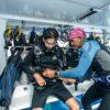 Divers gearing up on the dive deck