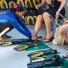 Fitting fins before snorkeling